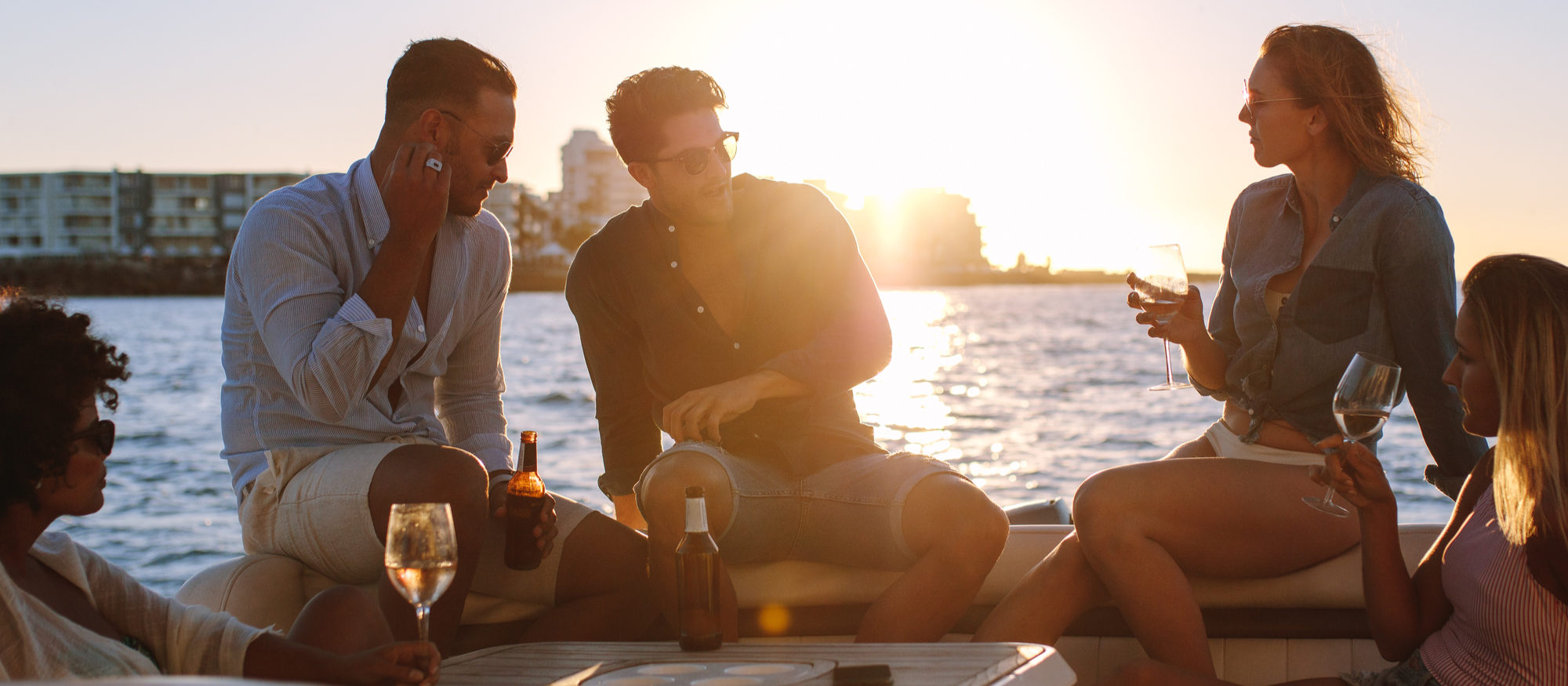 Friends drinking champagne on a boat